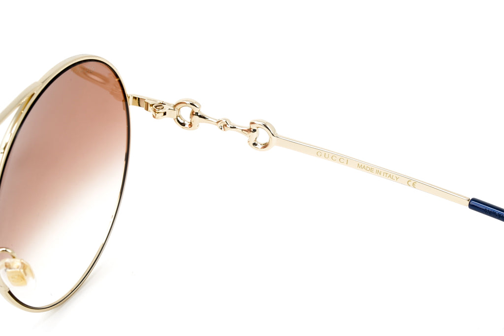 Gucci Women's Sunglasses Round Gold Pink